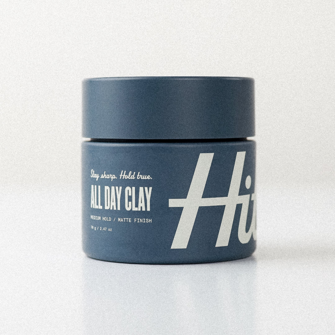 Blue jar of Hitch product, "All Day Clay" on white background.